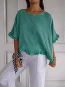 Blusinha Bellatriz™ com babado e caimento solto em algodão, moderna, confortável e ideal para mulheres elegantes.