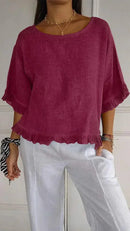Blusinha Bellatriz™ com mangas bufantes, babado e caimento solto em algodão, estilo moderno para mulheres confortáveis.