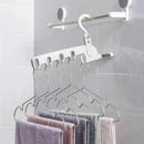 Kit com 4 porta cabides ModernLar para móveis, ideal para organizar roupas na mala de viagem, em imagem com cabides brancos e modernos