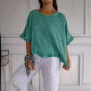 Blusinha Bellatriz™ com babado, manga longa e caimento solto em algodão, estilo moderno para mulheres confortáveis.