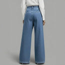 Calça jeans Anya™ da ModernLar com efeito transpassado e frente assimétrica sobreposta, modelo jeans feminino.