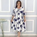 Vestido Magnolia Belle™ da ModernLar com estampa floral aérea, dupla camada e caimento leve e elegante.