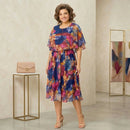 Vestido Midi Tropicália™ estampado com sobreposição, estilo moderno e confortável, ideal para looks casuais e elegantes.