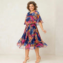 Vestido midi estampado Tropicália™ da ModernLar com sobreposição, tecido leve e design elegante para ocasiões especiais.